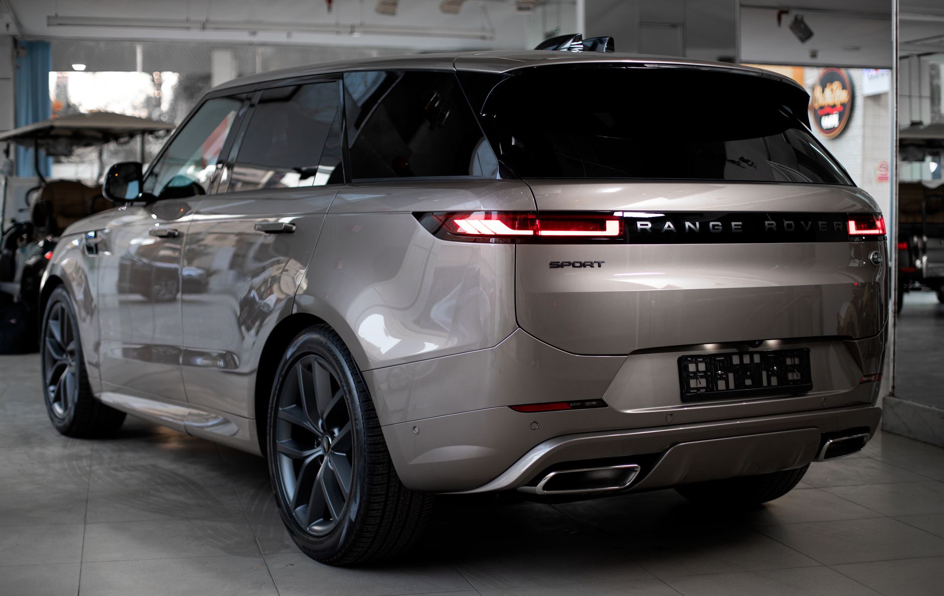 Elegant Range Rover SUV showcased in a stylish automobile showroom in Egypt.