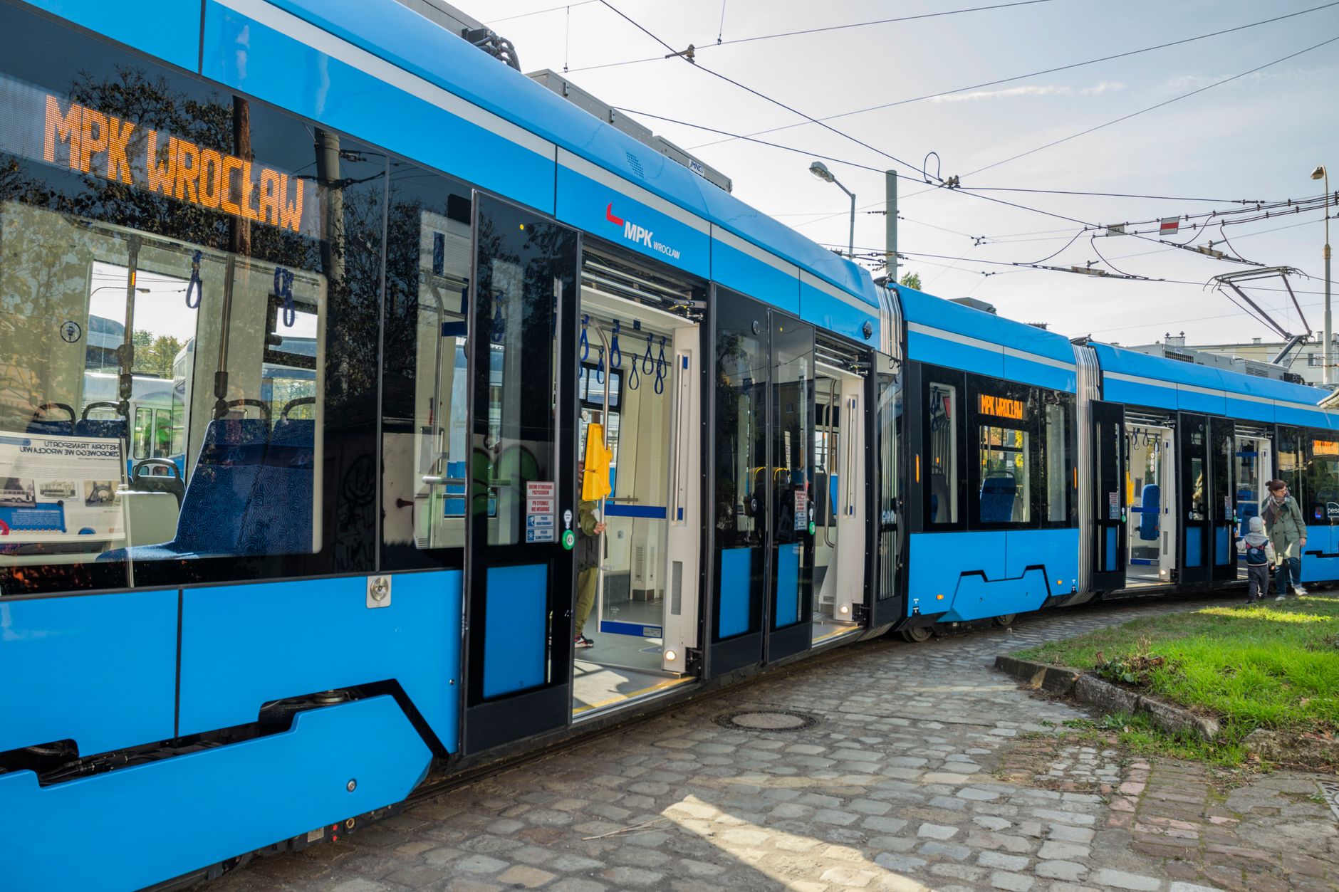 A sleek modern tram in Wrocław, captured on a sunny day. Urban transportation in Poland.